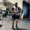 muscular man flexing in great fitting shorts with tights from King Killers Apparel