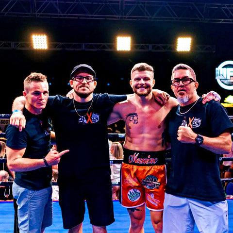 coach ryan mosburg and professional boxer Theran Cade of Mosburg Boxing celebrating a professional boxing victory