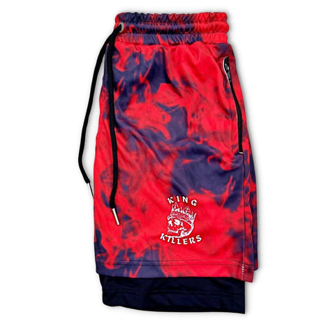 side view of 2 in 1 hybrid gym shorts with a red smokey pattern design and king killers logo on left leg